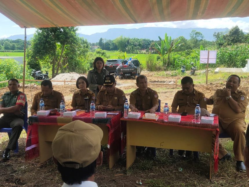 Camat Laguboti menghadiri Serah Terima Bantuan di Desa Simatibung